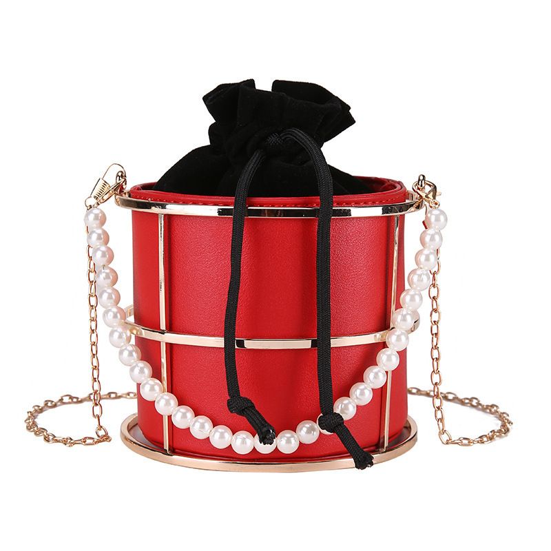 Articolo caldo Iron Art Hollow Drawstring Bucket New Ins Trend Pearl Handheld Chain Elegante borsa a tracolla_voghion.com