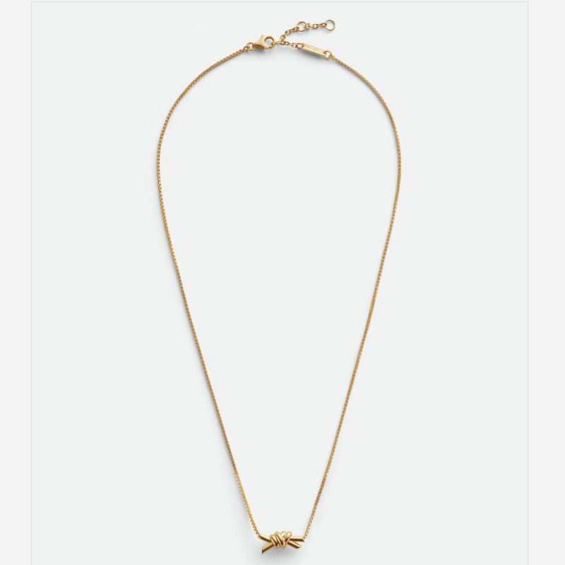 Set di gioielli da donna - Collana, bracciale e orecchini con design minimalista a nodo geometrico in oro e argento, eleganza quotidiana_voghion.com