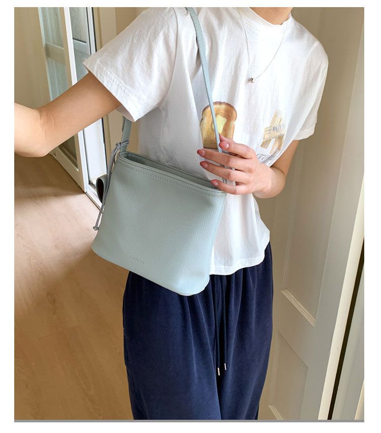 Borsa a secchiello semplice da portare a mano in stile coreano per le donne 2025, nuova nicchia versatile casual, trama litchi, spalla singola_voghion.com