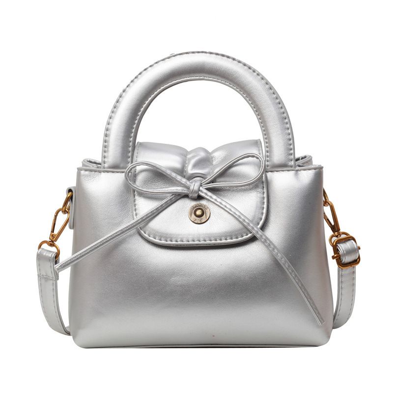 Borsa a mano con fiocco e tracolla elegante_voghion.com