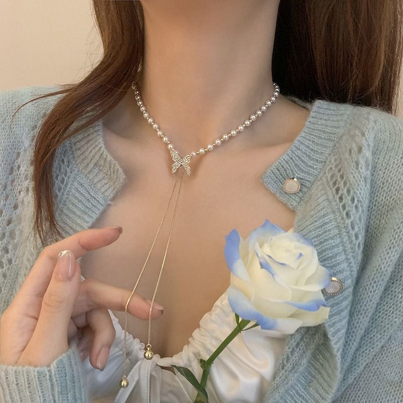 Pearl necklace for women, necklace design, niche butterfly tassel pendant, clavicle chain 2023 new_voghion.com