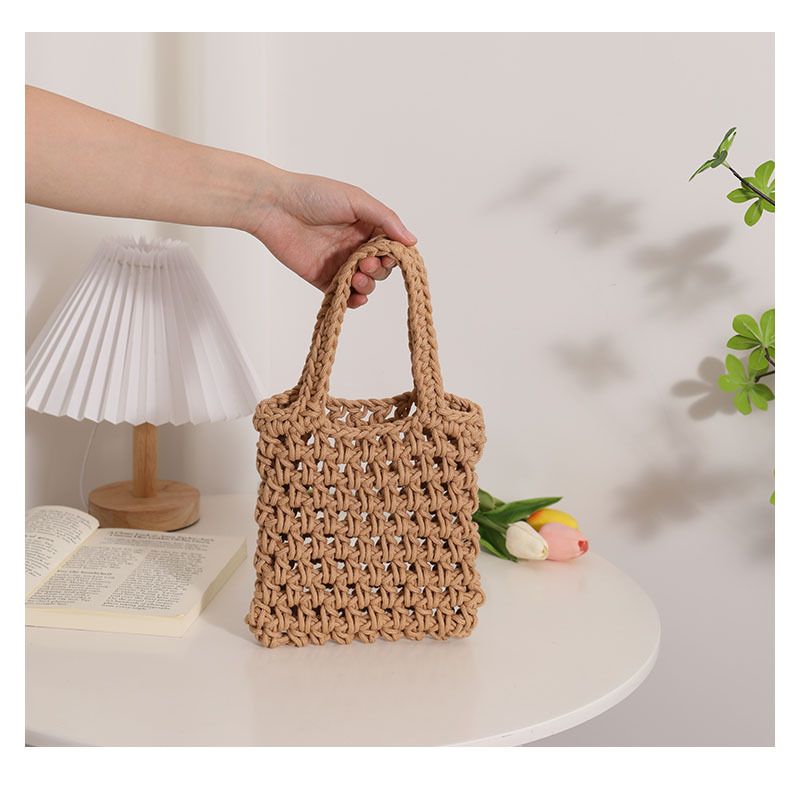 Borsa in tessuto cavo a mano di vendita calda transfrontaliera nuova borsa da donna fatta a mano in filo di cotone legato a mano in tinta unita borsa versatile in paglia con motivo a rete_voghion.com