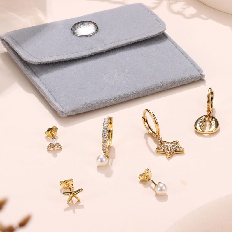 Unisex Hot Selling Real Gold Brass Electroplating Personality Niche High End Three Dimensional Five Pointed Star Earrings Temperament Earrings_voghion.com