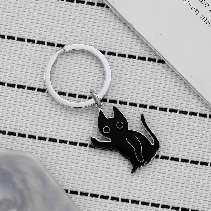 Portachiavi a forma di gattino scontento, divertente, in acciaio inossidabile, con ciondolo a forma di gatto nero con dito medio verticale._voghion.com