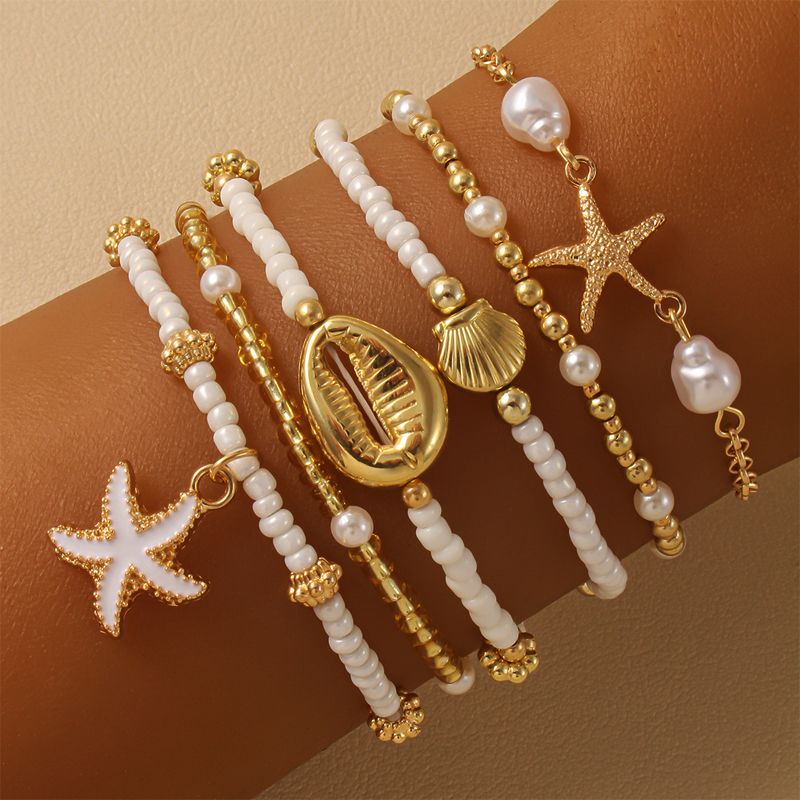 Set di braccialetti con perline a forma di stella marina per donna, alla moda, estivi, da spiaggia, multistrato, con perle impilate, gioielli da festa, regali_voghion.com
