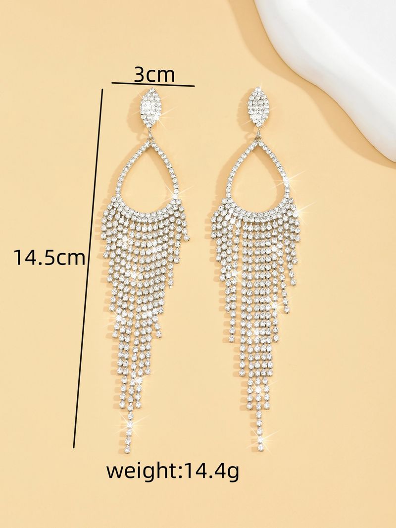 Nouveau style de luxe léger et polyvalent avec des gouttes d'eau incrustées de diamants, de longues boucles d'oreilles à pampilles, une exagération à la mode,_voghion.com