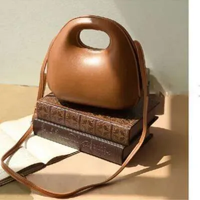 Borsa a tracolla rotonda con patta, modello conchiglia, modello retrò, da donna, modello 2025, modello a tracolla_voghion.com