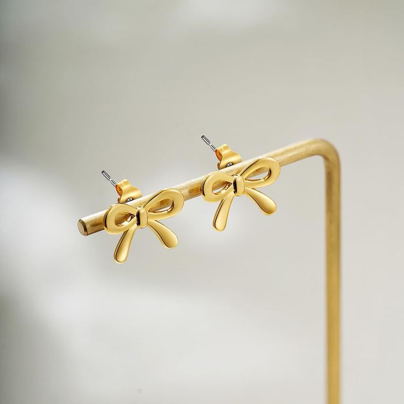 Vendita calda di veri orecchini in ottone placcato oro, piccoli e carini, mini orecchini a fiocco, alla moda e versatili._voghion.com
