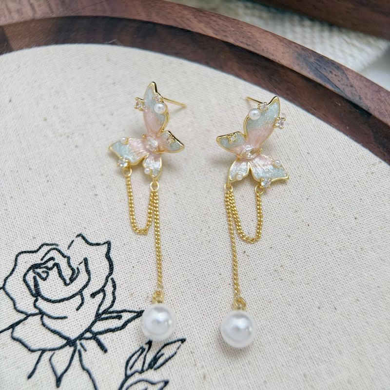 Orecchini di perle squisite coreane con nappa lunga e farfalla, di lusso leggero e di alta qualità, da donna_voghion.com