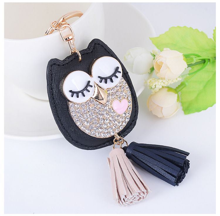 Portachiavi per auto con nappa a forma di testa di gatto in pelle, stile creativo, ciondolo per borsa da donna_voghion.com