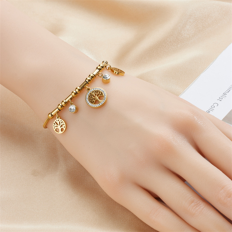 Bracciale con ciondolo albero della vita cavo in metallo con temperamento retrò di fascia alta di nicchia alla moda. Bracciale in acciaio al titanio_voghion.com