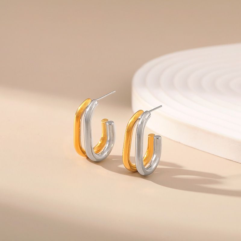 Gold and silver contrasting design personality earrings K real gold plated niche metal texture cross twist earrings_voghion.com
