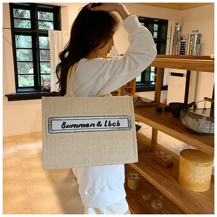 Baigou Wholesale Bag Women 2023 New European and American Trend Portable Canvas Bag Large Capacity Embroidered Alphabet Tote Bag_voghion.com