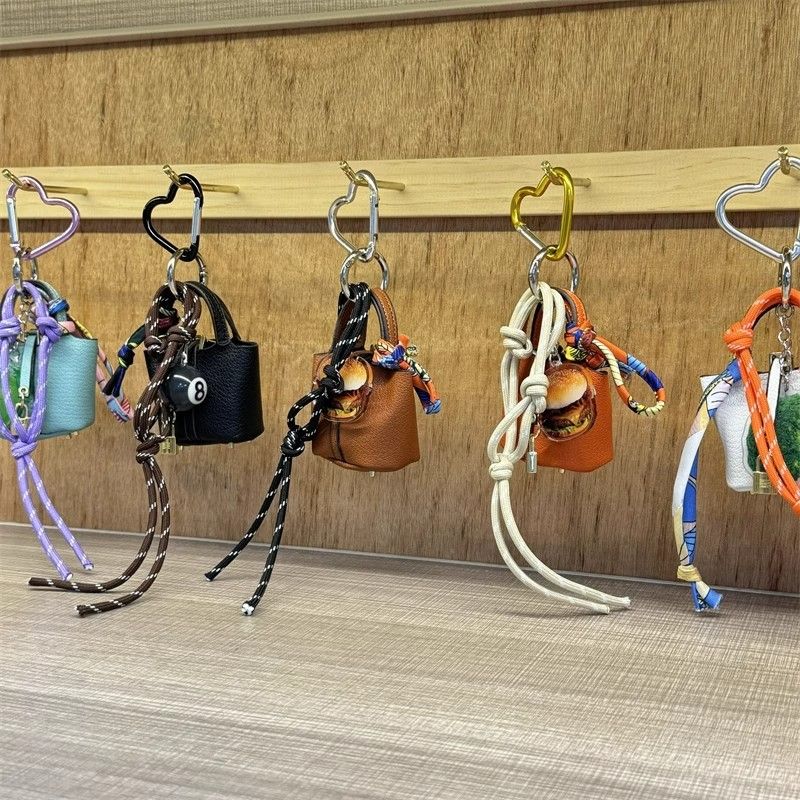 Mini ciondolo trendy per borsa a secchiello - accessorio in corda intrecciata a mano per coppie, elegante decorazione fai da te per borsa a tracolla in più colori_voghion.com