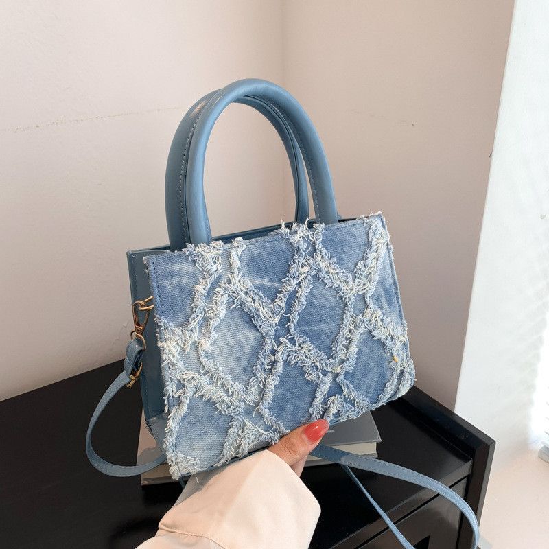 2025 Lente Zomer Nieuwe Veelzijdige High-End Denim Unieke Canvas Crossbody Tas Getextureerde Handheld Forensen Tote Bag_voghion.com