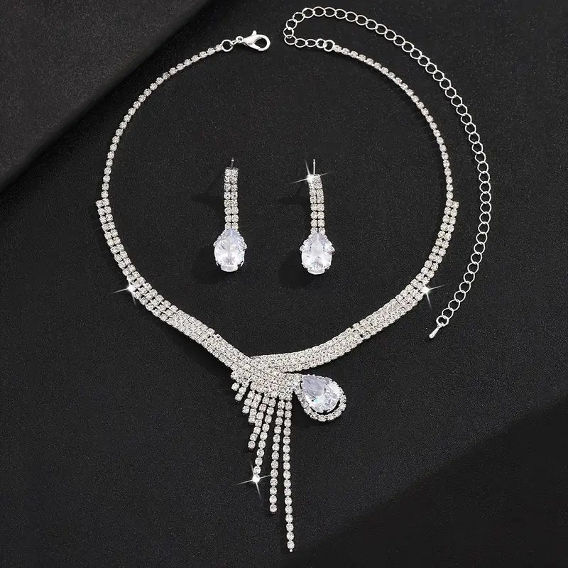 Collana orecchini bracciale con zirconi a goccia intarsiati di lusso e borsa da sera lucida, abito da banchetto in quattro pezzi_voghion.com