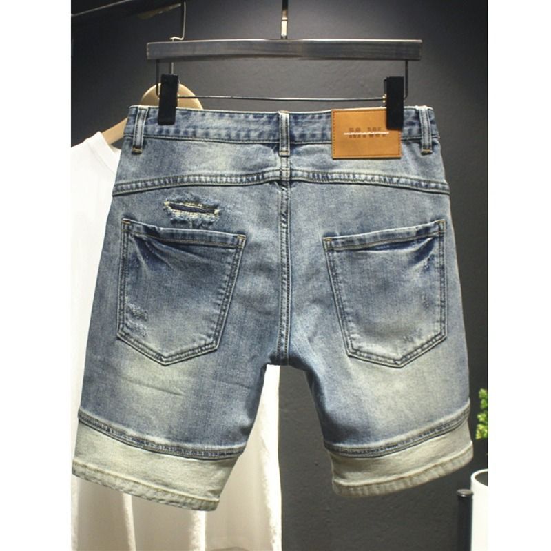 Pantaloncini in denim a blocchi di colore patchwork nuovi per l'estate 2025 da uomo, stile vintage, vestibilità slim, elasticizzati, a cinque punti_voghion.com