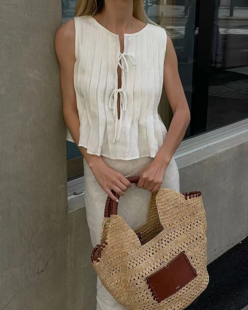 Completo da donna europeo e americano, primavera ed estate 2025, in cotone e lino, senza maniche, due pezzi, con camicia e gonna lunga da donna con spalline sottili._voghion.com