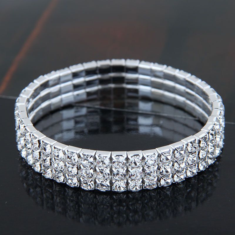 Set di gioielli da donna: elegante collana con strass, orecchini con nappe, bracciale e pochette per feste serali, borsa da sera, set di quattro gioielli_voghion.com
