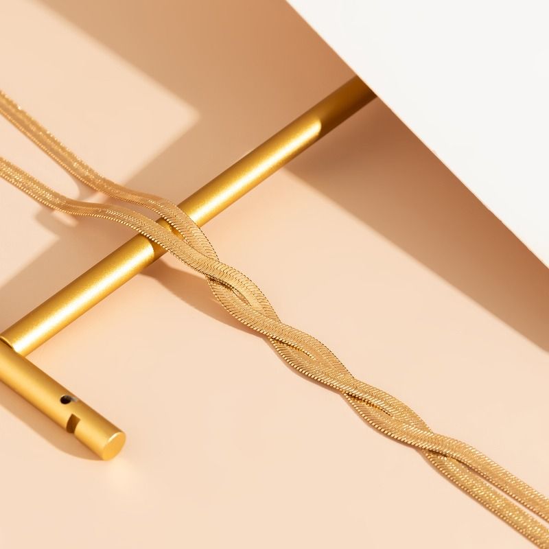 Collana con catena a serpente metallica bicolore per donna, collana a Y intrecciata in oro e argento, gioielli audaci per feste e serate fuori_voghion.com