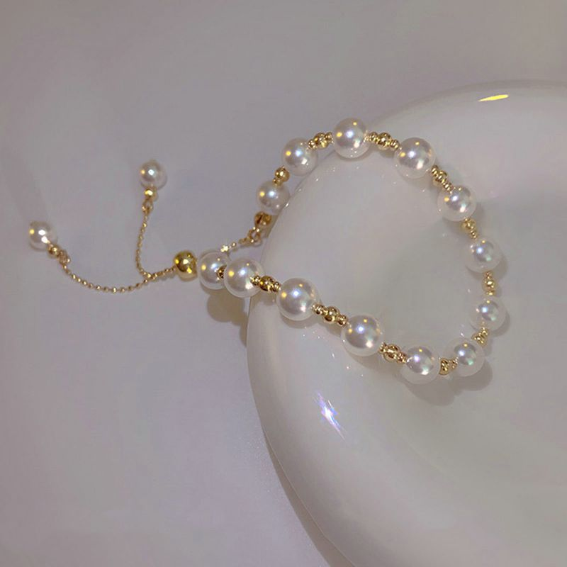 Shuosbai Damen-Armband mit Perlen, verstellbar, elegant, zierlich, schlichter Stil, Geschenk, goldene Hochglanz-Perlen, Modeschmuck_voghion.com