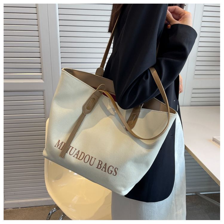 Canvas Große Damen 2023 Neue Mode Pendler Umhängetasche Einfarbig Brief Stil Urban Einfache Einkaufstasche_voghion.com