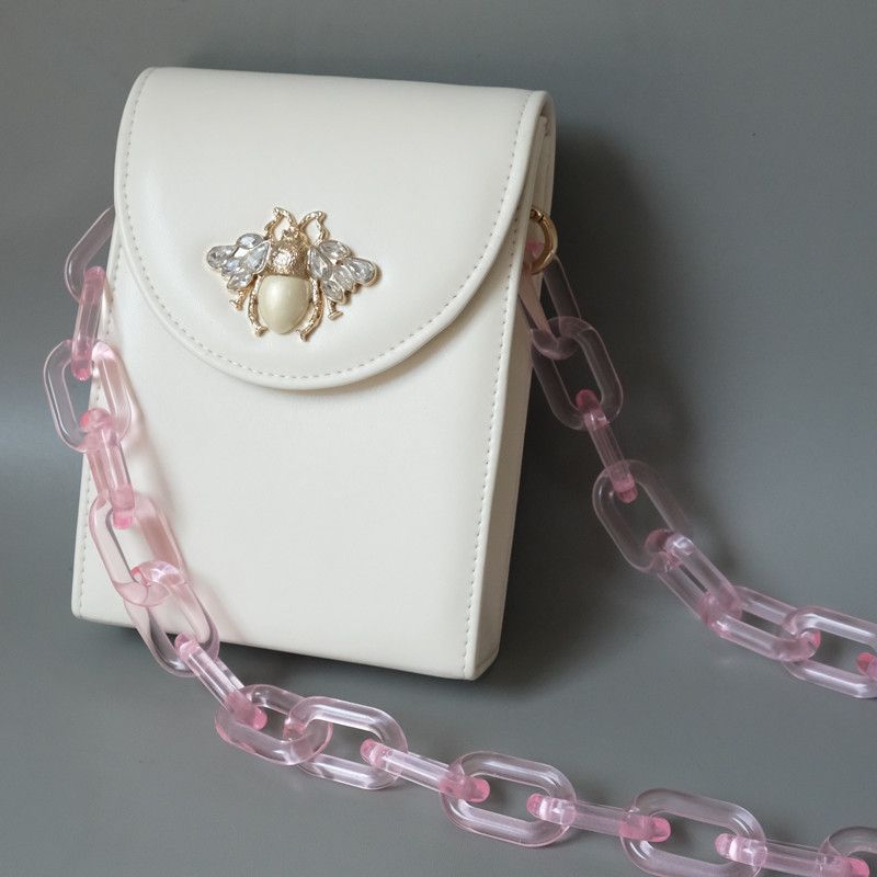 Borsa a tracolla con catena, tracolla singola, in resina acrilica spessa, versatile e alla moda, di colore caramella_voghion.com