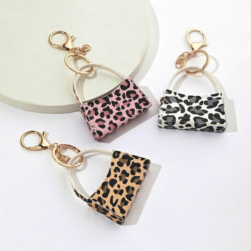 Porte-clés de sac incurvé imprimé léopard, petit porte-monnaie en cuir PU, pendentif transfrontalier pour sac de voiture, accessoires_voghion.com