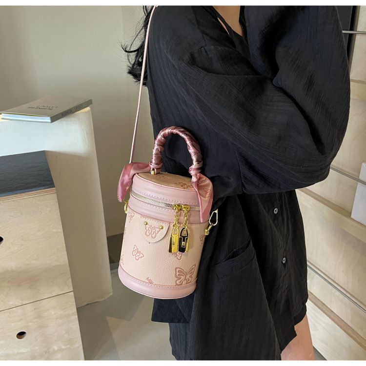 Borsa da donna retrò con motivo a farfalla, borsa a secchiello con colori a contrasto, borsa cilindrica da donna, borsa a tracolla con texture alla moda, design di nicchia_voghion.com