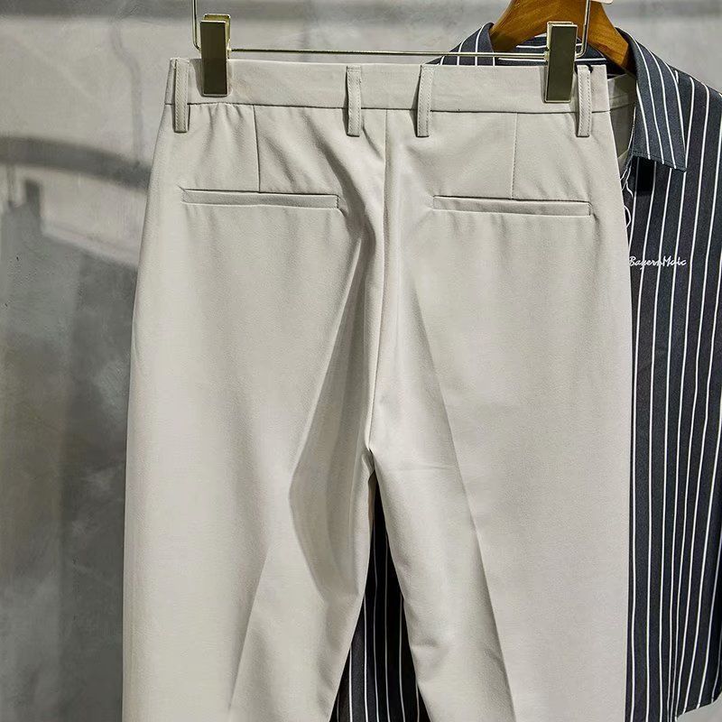 Pantaloni da uomo di design con lo stile di Hong Kong che entra nella moda, pantaloni a gamba dritta per la perdita di peso, pantaloni western drappeggiati casual e alla moda._voghion.com