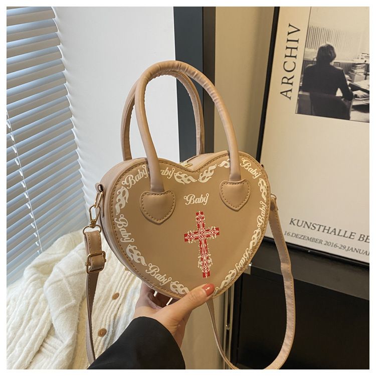 Borsa da donna personalizzata Rivet Punk Dark 2024 Nuova borsa a forma di cuore, borsa a tracolla incrociata, borsa a tracolla per donna_voghion.com