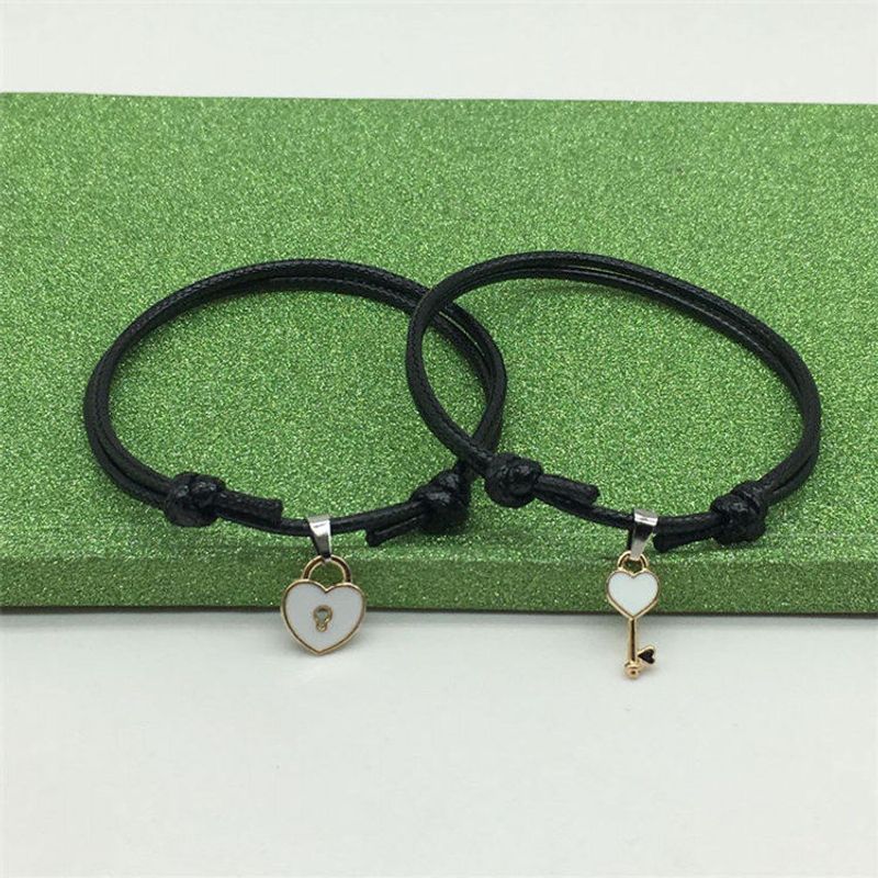 Un semplice braccialetto di coppia, chiave, lucchetto a cuore, accessorio, accessorio per bracciale_voghion.com