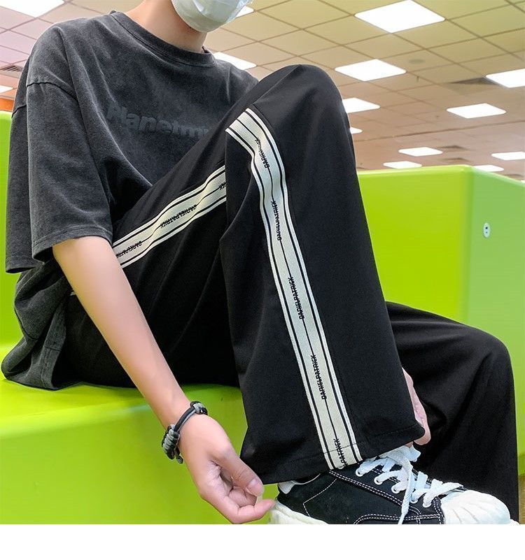 Ανδρικά ρούχα καθημερινά παντελόνια με ρίγες στο πλάι Ανδρικά νέα μοντέρνα παντελόνια φαρδιά πεσμένα παντελόνια High Street Straight σφουγγαρίστρα Αθλητικά παντελόνια_voghion.com