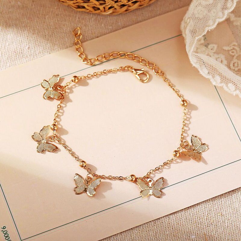 Braccialetto con ciondolo a farfalla di vendita calda selezionato con stile semplice ed elegante, catena per piedi da spiaggia, gioielli per piedi, accessori artigianali a forma di farfalla cava_voghion.com