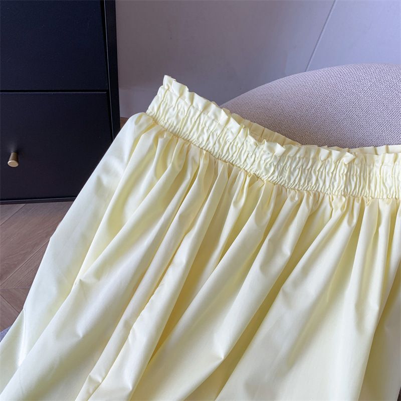 Gonna gialla da donna, a vita alta, a trapezio, sottile, di media lunghezza, con grande gonna a ombrello._voghion.com