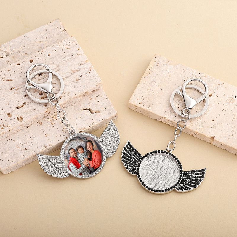 Portachiavi alla moda in stile hip hop con ala e strass: accessorio fai da te unico per uomini e donne (argento, diamante nero/rosa/bianco/blu)_voghion.com