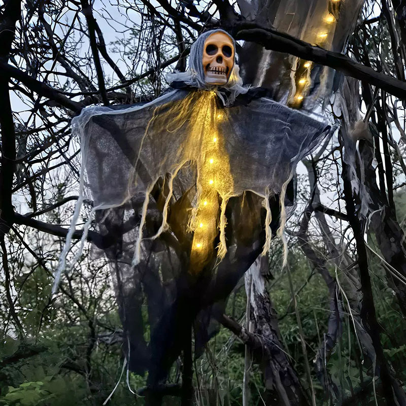 Glowing Skeleton Heads Hanging From The Outdoor Courtyard, Creating A Haunted Atmosphere With Ghostly Decorations For The Halloween Scene_voghion.com