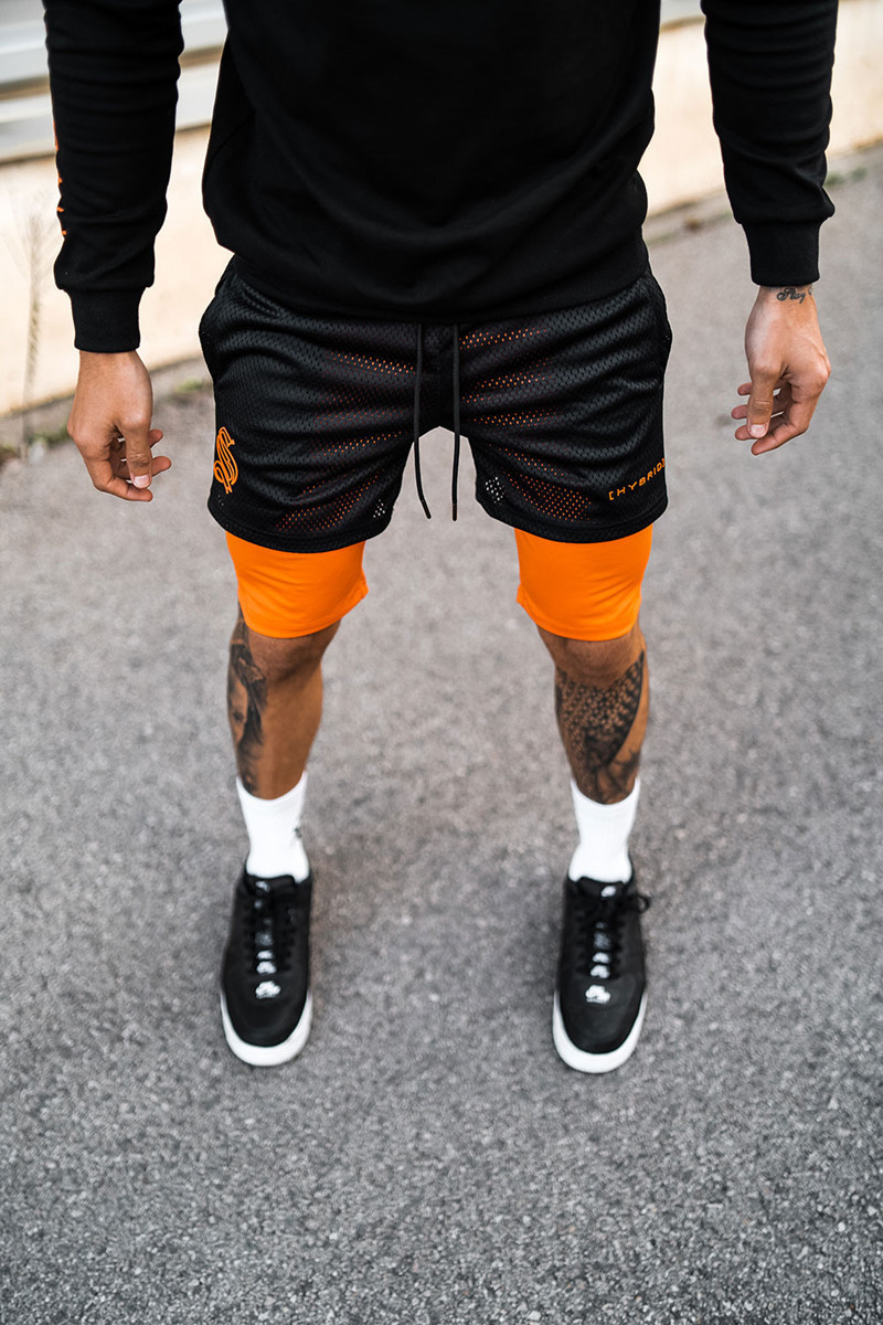 Pantaloncini sportivi alla moda a doppio strato per l'allenamento da uomo falso in due pezzi da basket in esecuzione fitness capris_voghion.com