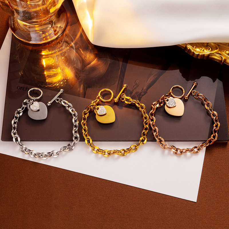 Semplice cuore di pesca Bracciale in acciaio al titanio con oro Anello con lettera Bracciale con fibbia a forma di T Bracciale in acciaio inossidabile a forma di cuore_voghion.com