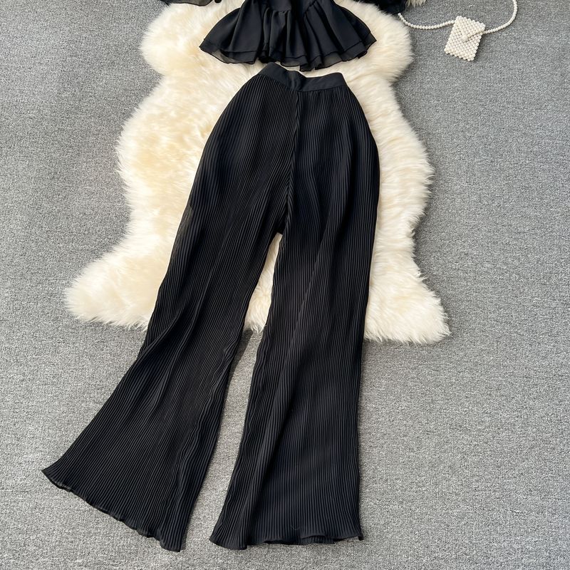 Vêtements pour femmes Costume de vacances pour femmes 2023 nouvelle chemise en mousseline de soie à bretelles à épaules dénudées à volants et pantalon large plissé drapé_voghion.com