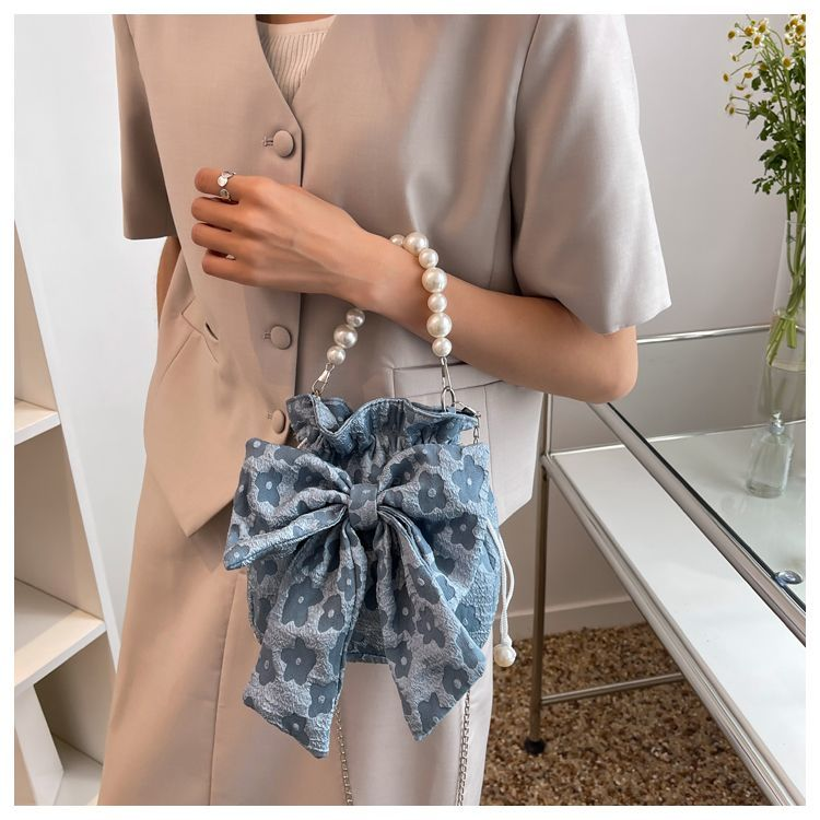 This year's popular niche for women, 2022, new trend, summer versatile, cute bow tie, pearl, handheld crossbody bag_voghion.com
