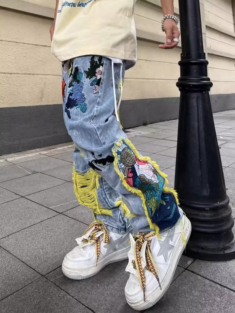 Vīriešu apģērbs Ielas džinsi ar bieziem izšuvumiem, saplēstas vīriešu garās bikses_voghion.com