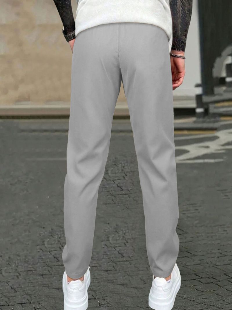 Pantaloni casual slim fit da uomo - Tinta unita, design a nove punti, dettaglio etichetta in pelle, comodi pantaloni con tasche_voghion.com
