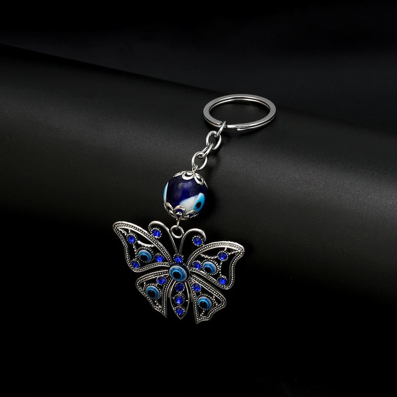 Portachiavi a forma di farfalla in lega con occhio del diavolo, da uomo e da donna, con fibbia per borsa tempestata di diamanti, accessorio da appendere all'auto_voghion.com