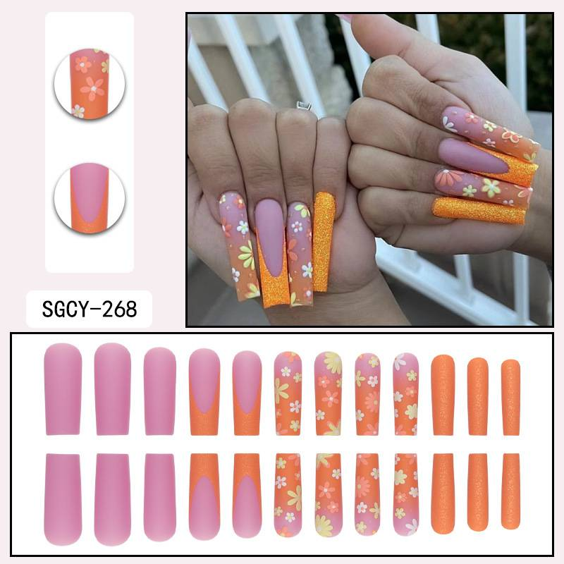 Unghie finte arancioni opache con disegni floreali multicolor - Unghie finte riutilizzabili per donna (opzioni colla/adesivo)_voghion.com