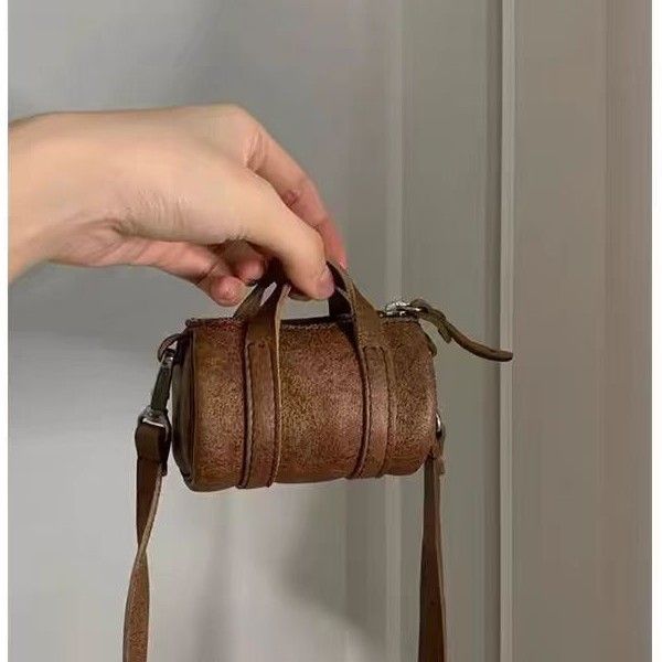 Niche High-End 2025 Summer New Brown Exquisite Neck Hanging Cylinder Single Shoulder Crossbody Mini Bag_voghion.com