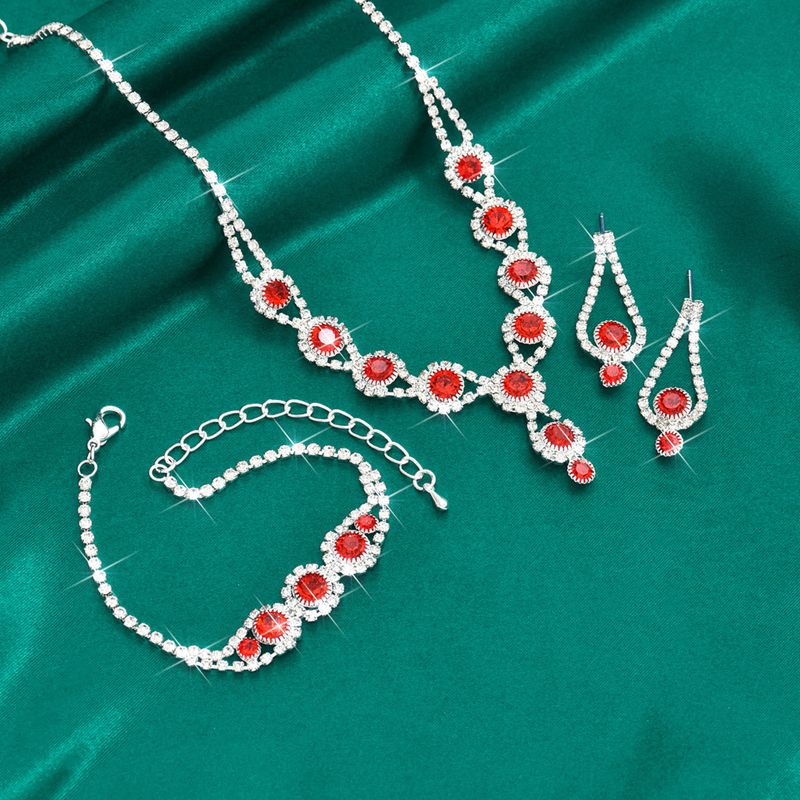 Set di tre pezzi di collana, orecchini e bracciale con strass rosa, blu e rosso, in vendita calda._voghion.com