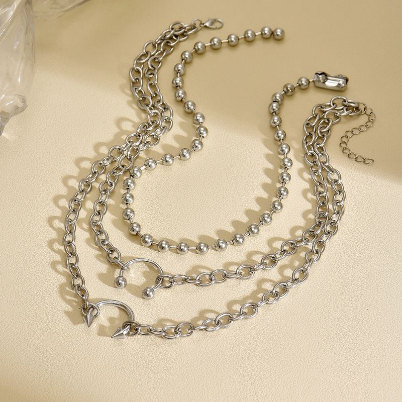Collana con ciondolo all'ingrosso, gioielli europei e americani, tendenza hip hop, personalità di nicchia, stile punk, design multistrato, collana_voghion.com