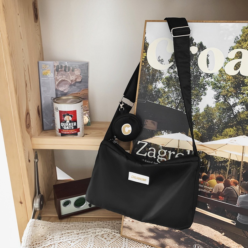 Bolso de Material de tela de nailon para mujer, nuevo diseño de nicho, diseño de banda ancha, bandolera de un hombro, bolso de bola de masa para mujer_voghion.com