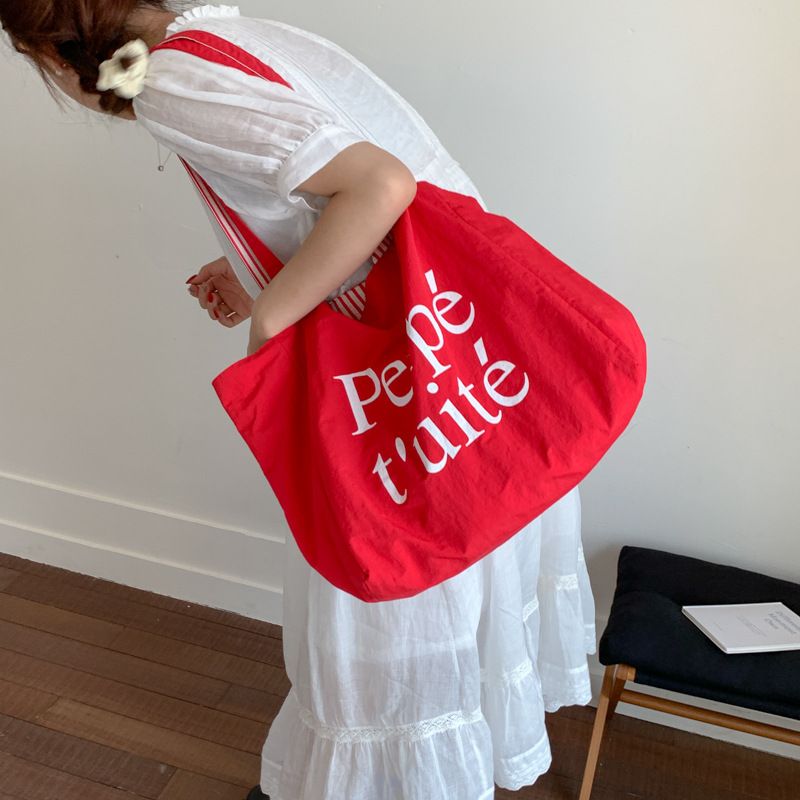 Sac fourre-tout décontracté en nylon de style coréen, sac à main à imprimé lettre tendance, sac à bandoulière simple rayé double face de célébrités d'Internet_voghion.com